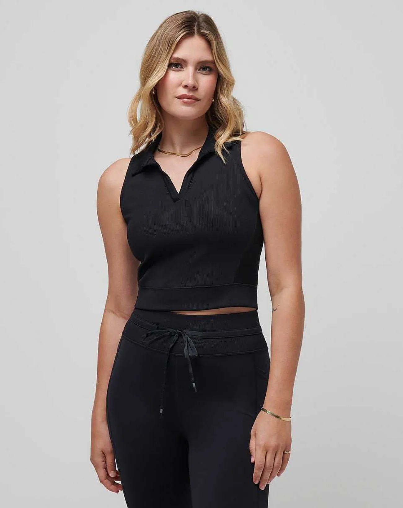 TravisMathew Polos>Moveknit Sleeveless Vneck Polo
